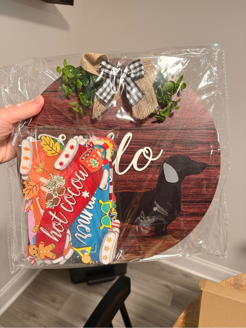 Home Holiday Round Welcome Plaque with Black Dachshund and Greenery